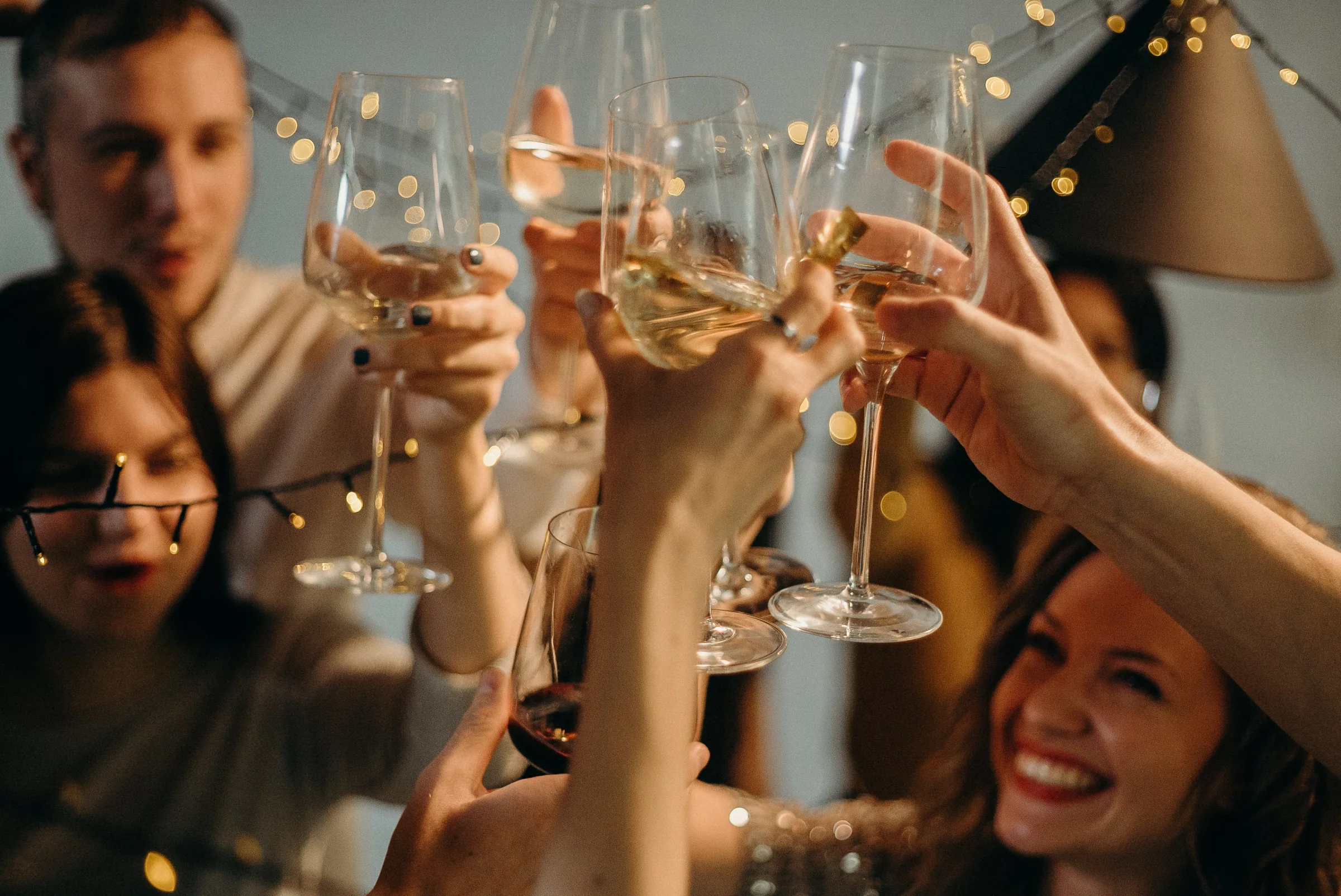 Friends raising glasses together